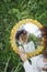 Beautifal mixed race woman wearing white dress and sky reflectio