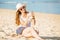 Beautifil young woman on the beach at sunny day