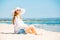 Beautifil young woman lying on the beach at sunny