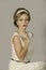 Beautiful 1950\'s woman with cream dress and headband