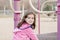 Beautiful 5-year Old Girl Playing Outside on a Playground