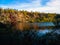 Beautiful abandoned granite quarry in the Dnieper in autumn