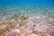 Beautiful abstract background / texture of underwater view of white sand bottom and blue water. Snorkling, Maldives,