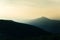 A beautiful, abstract, colorful sunset scenery in mountains in warm tones. Mountain landscape in colors.