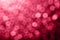 Beautiful abstract pattern with festive magenta bokeh, trendy color of year 2023. Bright blurred background. Defocus