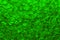 Beautiful abstract shimmer apple green sequin background texture close up. Party concept.