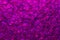 Beautiful abstract shimmer pink violet sequin background texture close up. Party concept