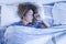 Beautiful adult caucasian lonely woman sleep alone in a double bed at home - concept of independence and portrait of people