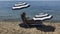 Beautiful adult woman in bikinin lays on deck chair at the beach and drink water