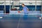 Beautiful adult woman playing table tennis in gym gaming club