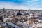 the beautiful aerial cityscape with a large dome and spires in europe