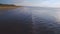 Beautiful aerial footage of sea waves reaching beach,