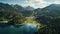 Beautiful aerial landscape of clear lake in lush green forest.