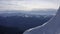 Beautiful aerial landscape winter mountain and snowy slopes on sky background
