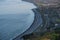 Beautiful aerial-like evening view of Killiney Beach, coastal line and railway seen from Killiney Hill during golden hour, Dublin