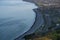 Beautiful aerial-like evening view of Killiney Beach, coastal line and railway seen from Killiney Hill during golden hour, Dublin