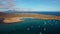 Beautiful aerial panning clip of Isla de Lobos island as well as the yachts and catamarans