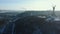 Beautiful aerial panorama of famous sunny winter Kyiv landmark, Motherland memorial statue towards cars on highway.