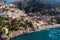Beautiful aerial panorama view of Positano bay. Rocky shores and incredible beaches, Luxury yachts, boats and hotels, apartments
