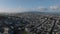 Beautiful aerial panoramic footage of large city. Houses in residential urban neighbourhoods and hills rising from water