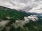 Beautiful aerial panoramic view of the Dolomites Alps, Italy. Mountains covered by clouds and fog. Catinaccio mountain