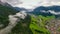 Beautiful aerial panoramic view of the Dolomites Alps, Italy. Mountains covered by clouds and fog. Catinaccio mountain ranges.