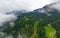 Beautiful aerial panoramic view of the Dolomites Alps, Italy. Mountains covered by clouds and fog. Catinaccio mountain ranges.