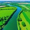 A beautiful aerial picture of verdant meadows and the Seine River in rural Northern Ile de Val