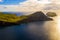 Beautiful aerial shot of green fields and hills near the sea in Ponta de Sao Lourenco in Portugal