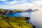 Beautiful aerial shot of green fields and hills near the sea in Ponta de Sao Lourenco in Portugal