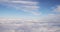 Beautiful Aerial View Of Clear Sky Over White Fluffy Clouds From Height Flight Of Plane