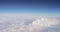 Beautiful Aerial View Of Clear Sky Over White Fluffy Clouds From Height Flight Of Plane