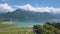 Beautiful aerial view of the coastline, blue sea water and mountains covered by green trees near the one of southern