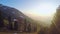 Beautiful aerial view of green mountain landscape, sun shining bright on horizon