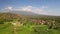 Beautiful aerial view of rural balinese landscape of green rice fields. Colorful ribbons against the background of palm