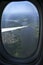 Beautiful aerial view seen through window of flying aeroplane