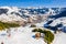 Beautiful aerial view of the ski resort village and mighty Alps