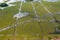 Beautiful aerial view of traffic on elevated road and tollway surrounded green rice fields