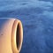 Beautiful aerial view through window of commercial airplane, part of the airplane wind and gas turbine engine