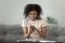 Beautiful African American woman using phone, browsing mobile apps