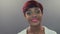 Beautiful African woman with pink lips turns with