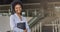 Beautiful Afro business woman holding a folder, looking at camera