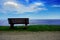 Beautiful Afternoon Scenic Solitary Bench View of the Lake and Sky