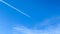 Beautiful aircraft vapor trails in a blue sky