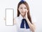 Beautiful Airline stewardess showing the mobile phone with blank screen on white background