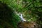 Beautiful allerheiligen waterfall in the forest. Germany Black Forest. Long quote exposure and trees. Cliff river