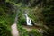 Beautiful allerheiligen waterfall in the forest. Germany Black Forest. Long quote exposure and trees. Cliff river