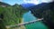 Beautiful alpin lake, aerial view of crossing bridge in summer s