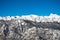 Beautiful alpine chain of snowy mountains of julian alps in blue sky