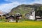 Beautiful Alpine landscape with church and typical Swiss houses at spring sunny day , Inden village , canton of Valais , Switze